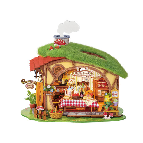 Completed model kit of a grass-roof cottage