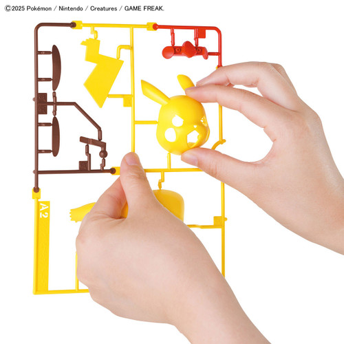 Hands remove model pieces from their plastic sprue