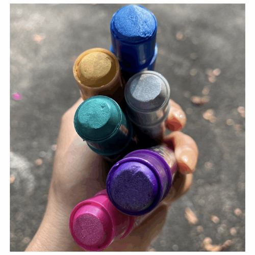 the tops off the markers to reveal the colors
