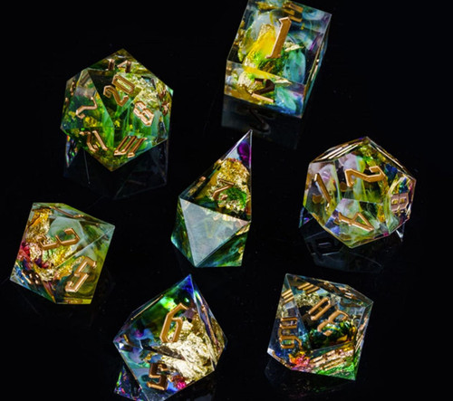crystal clear green dice with gold numbers.