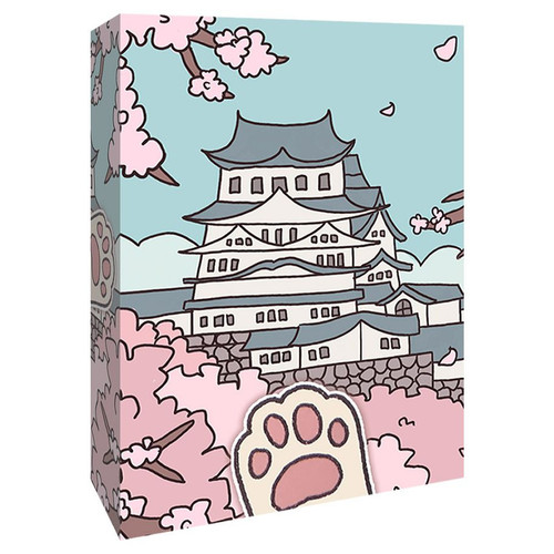 front of card box with building with pink blossoms and a paw