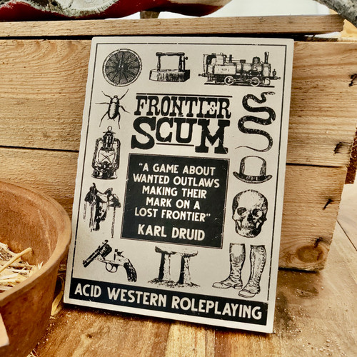 Book cover depicting Western tropes like a skull, a revolver, a train engine and more