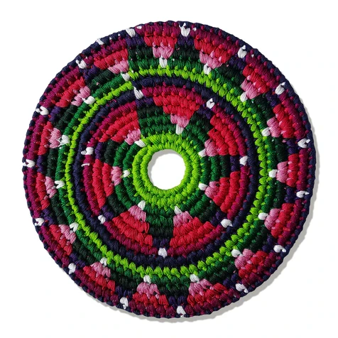 Crocheted fabric disc in colorful patterns