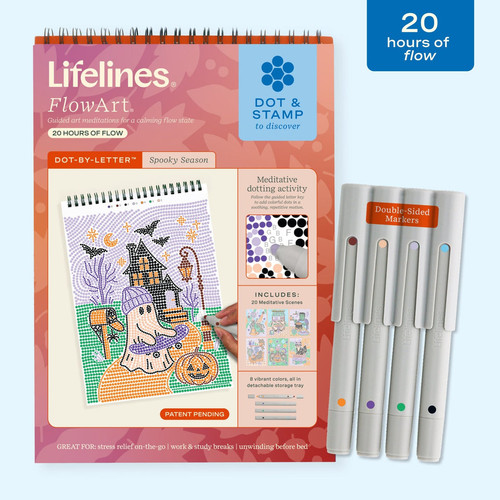 a spined notebook with a ghost on the front and markers