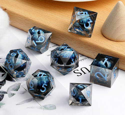 Transparent resin dice with blue dragon eyes inside