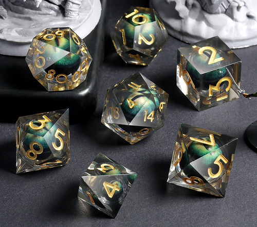 Transparent resin dice set with green dragon eyes inside
