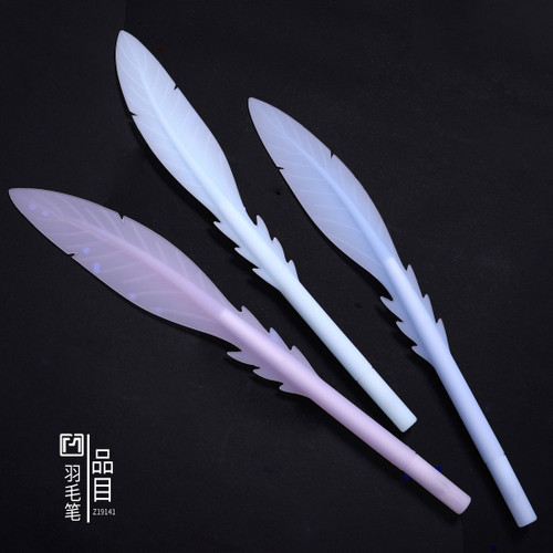 three pens of silicone feathers with caps