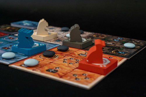 Gameplay setup depicting a tiger, bird and tortoise surrounding a floating stone cube