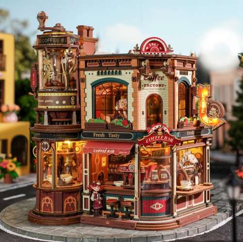 Completed model kit of a whimsical coffee factory building