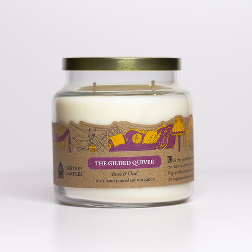 candle with tan label and purple sofa