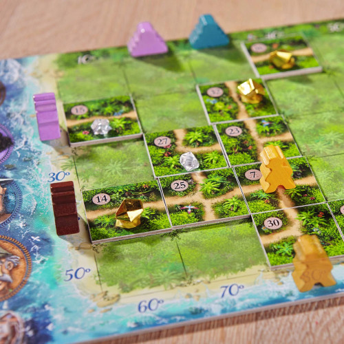 Gameplay, wooden explorer tokens follow jungle paths on square tile pieces