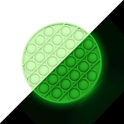 Glow-in-the-Dark Round Pop Fidgety shown with half-white/half-blackground.