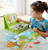 Child playing with The Seasons, Magnetic Game Box 