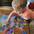 Young child placing a piece into a tray puzzle