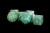 Green stone dice with gold numerals