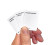 A hand holds three example cards