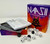 The game components featuring a score pad, rule book and many black and white dice