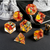 Transparent dice set with amber-color inclusions