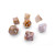 Set of seven dice made from coral fossil