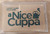 tan wallet sized card holder featuring a tea kettle and the title of the game.