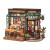 Completed model of a restaurant exterior with outdoor seating
