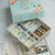 Box open with game components in beautiful compartments