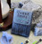 front of card box surrounded my sand timer and miniatures