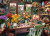 Puzzle image, depicting flower arrangements on a desk in a shed