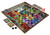 checker like pieces across a grid of different landscapes  and a deck of cards, mid game 