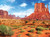 Monument Valley desert scene with a blue sky