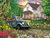 Simpler Times puzzle depicting white farm house surrounded by hens, trees and flowers. with a blue truck out front