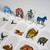 Close up of several Animals & Familiars 62pc—Flat Plastic Mini