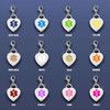 A product display featuring twelve heart-shaped medical alert charms arranged in a grid against a dark blue background with subtle sparkle effects. Each charm has a polished silver base, a lobster clasp, and a central "Star of Life" symbol in a distinct color or metallic finish. The colors, labeled below each charm, include: "DEEP BLUE," "BLUE," "GREEN," "YELLOW," "ROSE GOLD," "WHITE," "GOLD," "ORANGE," "RED," "PURPLE," "PINK," and "VIOLET." The charms are evenly spaced, showcasing the variety of customization options available for personal medical identification. A product display featuring twelve heart-shaped medical alert charms arranged in a grid against a dark blue background with subtle sparkle effects. Each charm has a polished silver base, a lobster clasp, and a central "Star of Life" symbol in a distinct color or metallic finish. The colors, labeled below each charm, include: "DEEP BLUE," "BLUE," "GREEN," "YELLOW," "ROSE GOLD," "WHITE," "GOLD," "ORANGE," "RED," "PURPLE," "PINK," and "VIOLET." The charms are evenly spaced, showcasing the variety of customization options available for personal medical identification.