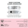Promotional image for custom laser-engraved medical ID tags. The top section on a white background displays two rectangular silver ID tags with rounded edges. The first tag is engraved with 'BLOOD THINNER,' 'ICE CONTACT,' 'RICK JOHNSON,' and '(619) 866-4768.' The second tag features a black medical caduceus symbol and text: 'DIABETES/INSULIN,' 'ALGY: PENICILLIN,' 'NUTS, BEE STING,' and 'SEE OTHER SIDE.' Below the tags, text highlights the high contrast and legibility of the engraving. The bottom section on a pink background lists features like 'TOUGH & DURABLE,' 'ELEGANT & STYLISH,' 'CUSTOM MEDICAL IDS SAVE LIVES,' 'FREE ENGRAVING IN THE USA,' and 'QUICK 1-DAY PROCESSING,' accompanied by simple black icons. Promotional image for custom laser-engraved medical ID tags. The top section on a white background displays two rectangular silver ID tags with rounded edges. The first tag is engraved with 'BLOOD THINNER,' 'ICE CONTACT,' 'RICK JOHNSON,' and '(619) 866-4768.' The second tag features a black medical caduceus symbol and text: 'DIABETES/INSULIN,' 'ALGY: PENICILLIN,' 'NUTS, BEE STING,' and 'SEE OTHER SIDE.' Below the tags, text highlights the high contrast and legibility of the engraving. The bottom section on a pink background lists features like 'TOUGH & DURABLE,' 'ELEGANT & STYLISH,' 'CUSTOM MEDICAL IDS SAVE LIVES,' 'FREE ENGRAVING IN THE USA,' and 'QUICK 1-DAY PROCESSING,' accompanied by simple black icons.