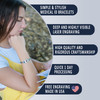 Promotional image for medical ID bracelets. The left side features a young woman with long dark hair, wearing a white t-shirt and yellow overalls, thoughtfully resting her chin on her hand while wearing a silver medical ID bracelet with a red medical alert symbol. The right side displays five dark blue text blocks on a light gray background, highlighting product features: 'SIMPLE & STYLISH MEDICAL ID BRACELETS,' 'DEEP AND HIGHLY VISIBLE LASER ENGRAVING,' 'HIGH QUALITY AND RIGOROUS CRAFTSMANSHIP,' 'QUICK 1 DAY PROCESSING,' and 'FREE ENGRAVING MADE IN USA,' with a heart-shaped American flag icon next to the last point.