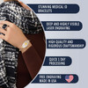 An advertisement for medical ID bracelets featuring a woman wearing a stylish bracelet on her left wrist. The bracelet has a central oval silver plate with intricate designs and a gold medical symbol, connected by alternating silver and gold chain links. The woman is dressed in a ribbed brown top and a black-and-white textured scarf, with a black square ring on her middle finger. On the right, five dark blue text boxes list product features: "STUNNING MEDICAL ID BRACELETS," "DEEP AND HIGHLY VISIBLE LASER ENGRAVING," "HIGH QUALITY AND RIGOROUS CRAFTSMANSHIP," "QUICK 1 DAY PROCESSING," and "FREE ENGRAVING MADE IN USA," with a heart-shaped American flag icon next to the last point. The design emphasizes elegance, quality, and functionality.