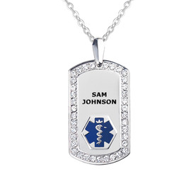 A silver medical alert dog tag pendant displayed against a white background. The pendant features a polished silver surface bordered by small, clear gemstones. At the top center, the name "SAM JOHNSON" is engraved in bold, black uppercase letters. Below the name, a blue hexagonal emblem with a white "Star of Life" medical symbol is prominently displayed. The pendant hangs from a delicate, fine-link silver chain, attached via a polished silver bail. The design combines elegance with functionality, ensuring critical medical information is easily accessible. A silver medical alert dog tag pendant displayed against a white background. The pendant features a polished silver surface bordered by small, clear gemstones. At the top center, the name "SAM JOHNSON" is engraved in bold, black uppercase letters. Below the name, a blue hexagonal emblem with a white "Star of Life" medical symbol is prominently displayed. The pendant hangs from a delicate, fine-link silver chain, attached via a polished silver bail. The design combines elegance with functionality, ensuring critical medical information is easily accessible.