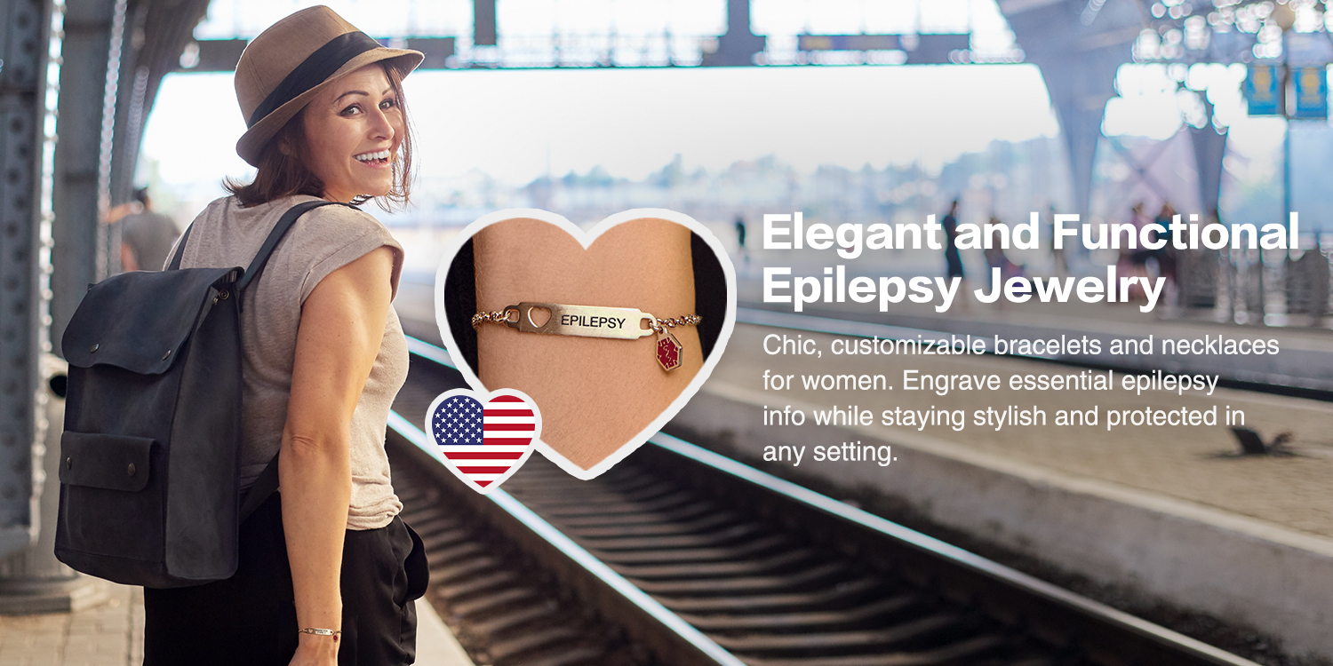 A stylish woman stands on a train platform, wearing a light brown fedora, a light-colored top, and a dark backpack. Overlaid on the image is a heart-shaped graphic showing a close-up of a metallic medical ID bracelet engraved with "EPILEPSY" and a red medical alert charm. Another smaller heart-shaped graphic with an American flag design is positioned in the bottom left corner. White text on the right reads, "Elegant and Functional Epilepsy Jewelry," promoting chic, customizable bracelets and necklaces for women to engrave essential epilepsy information while staying stylish and protected.