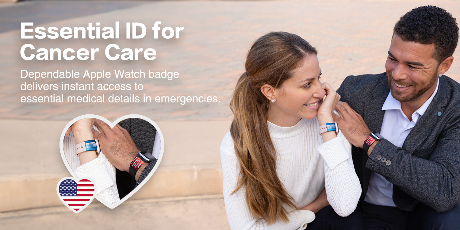 A smiling couple outdoors showcasing medical ID badges attached to their Apple Watch bands. The woman on the left wears a light-colored watch band with a blue medical badge, while the man on the right wears a dark-colored band with a red badge. Overlaid text highlights the product as an "Essential ID for Cancer Care," offering instant access to critical medical details in emergencies. A heart-shaped inset shows a close-up of the badges on their wrists, with an American flag heart icon below.