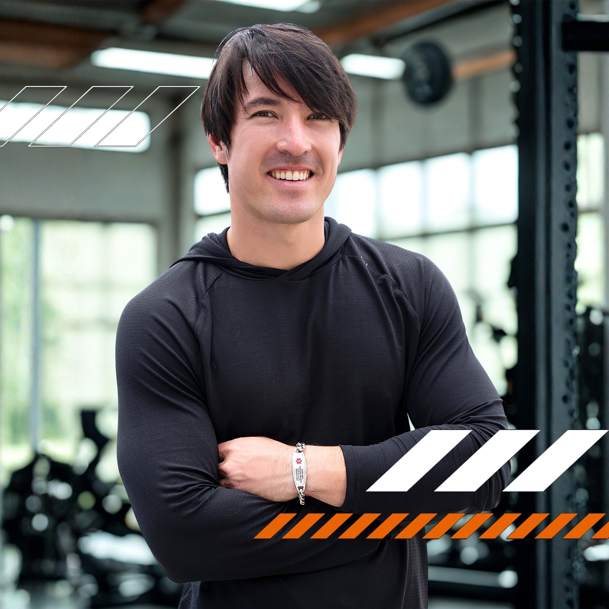 A smiling man in a black hooded shirt wearing a silver medical alert bracelet engraved with "DIABETES," "BLOOD THINNER," and "SEROQUEL." The background features a blurred gym setting with stylized graphic elements.