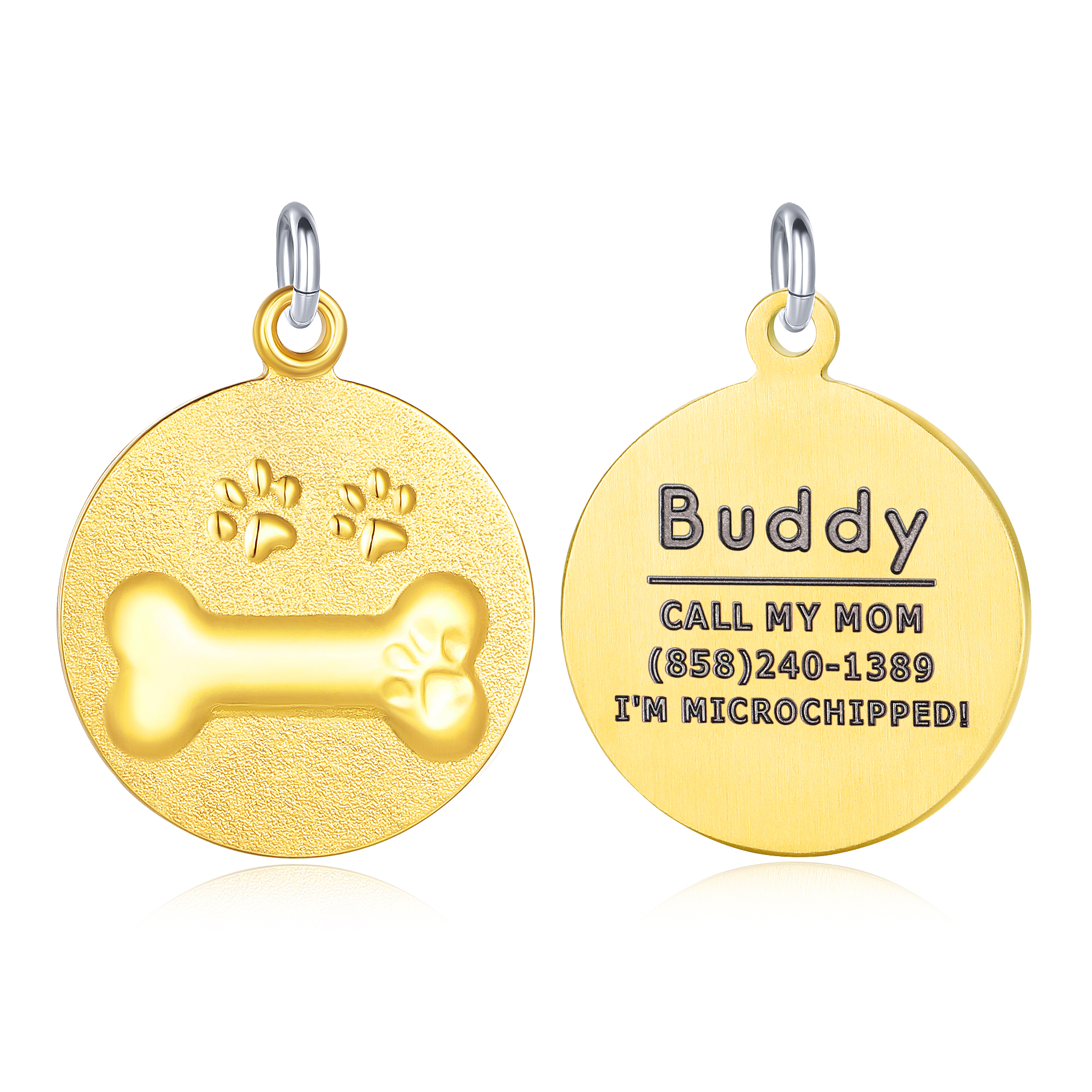 Set of two gold circular pet ID tags, one featuring embossed paw prints and a bone design, and the other engraved with personalized text including the pet's name, contact number, and microchip status.