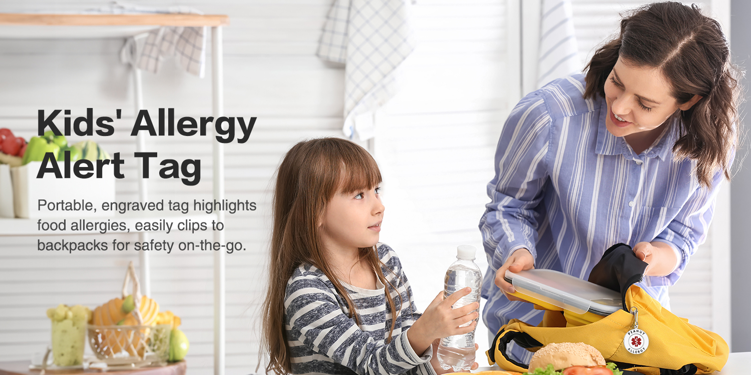 A promotional image showcasing a "Kids' Allergy Alert Tag" in a home setting. The scene features an adult woman and a young girl interacting near a yellow backpack. The white circular allergy tag, clipped to the backpack, prominently displays "PEANUT ALLERGY" with a red medical alert symbol. The left side of the image includes text describing the tag as a portable, engraved safety device for children with food allergies. The background highlights a clean, bright kitchen with fruits and a checkered towel, emphasizing care and safety.