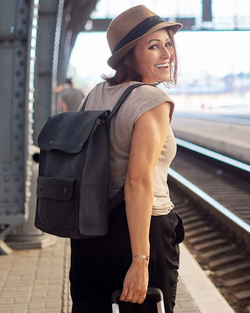 Traveler with a backpack wearing a medical ID bracelet