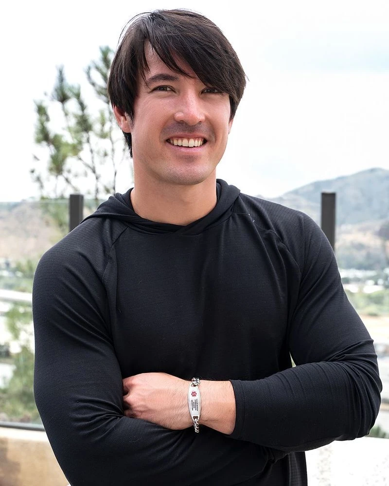 Man wearing a Divoti medical ID bracelet outdoors
