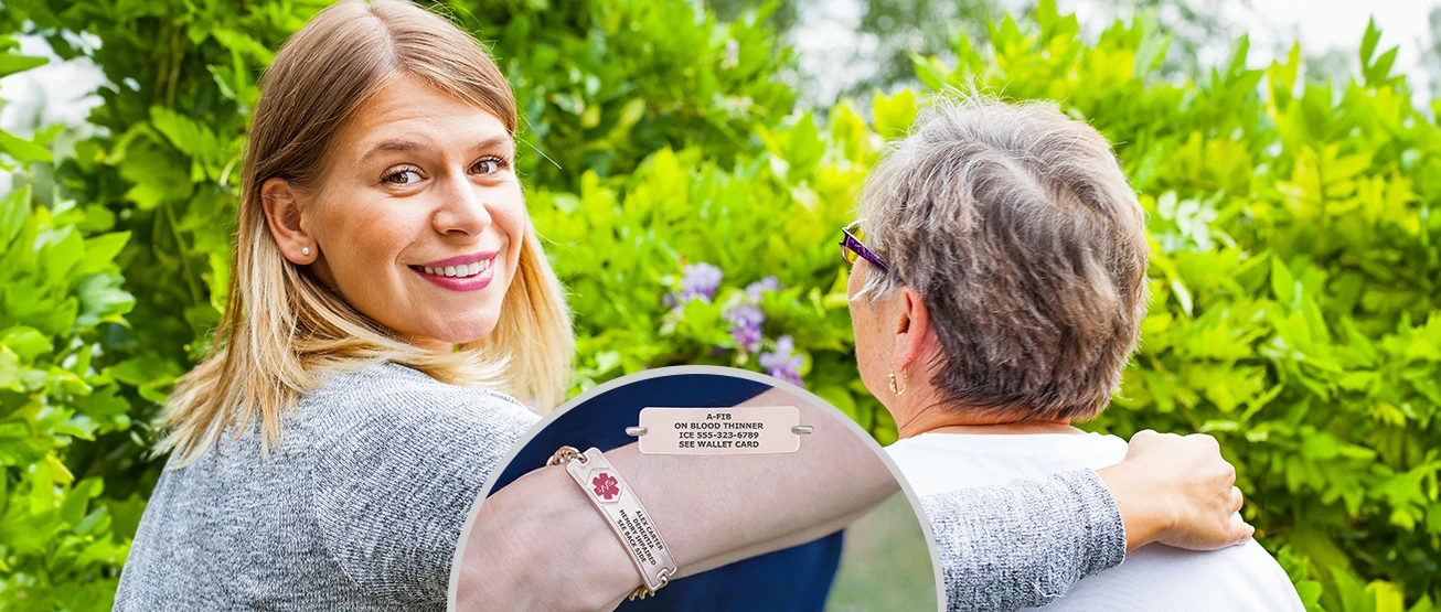 Senior wearing a Divoti custom-engraved medical alert bracelet