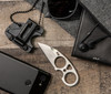The SOG Snarl Fixed Blade Knife is a collaboration between SOG Knives and knife maker Jason Brous. The SOG Snarl is a heavy-duty neck knife that is ideal for everyday carry. The sheepsfoot blade design provides a straight cutting edge that cuts cleanly. The unique handle design allows users to slip two fingers through holes in the skeletonized handle. The result is a blade that you won't drop-a real plus in self-defense situations or when working on and around the water. The small overall size makes the Snarl comfortable to carry all day, even at .25" thick the skeletonized design and short overall length make for a knife so light you will probably forget you are carrying it. The molded polymer sheath is extremely versatile, allowing for reversible belt carry or around your neck. The SOG Snarl is lightweight, heavy-duty, and razor sharp.