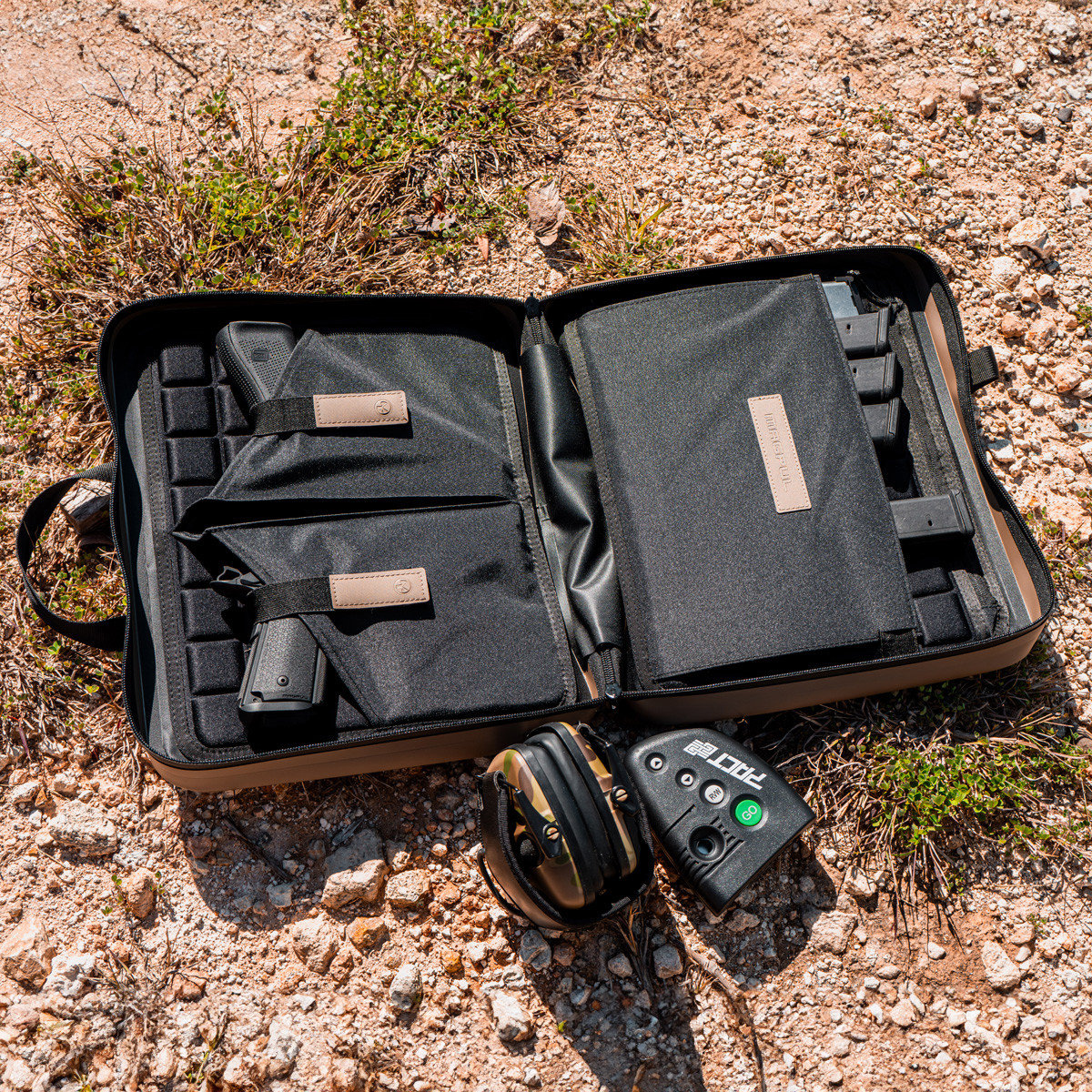 The DAKA Double Pistol Case is a large-format carrying case designed to secure and protect your firearms. The discrete, semi-rigid, double pistol case includes two large carrying handles, making it perfect for transporting and storing all sizes of pistols and their magazines.

The two internal panels are lined with a snag-free, protective EVA foam liner that adds a layer of security and a barrier against damage. On the left panel, there are two large pistol sleeves that can accommodate subcompact, compact, and full-size pistols. Each pistol sleeve has its own retaining strap that can stretch to accommodate a variety of pistol sizes. On the right panel, there are eight magazine retention bands and a large outer panel pocket to protect your pistols from contacting your magazines and causing damage. An additional zippered pocket can also be used to store documents, small tools, or cleaning items.

Constructed of durable DAKA material and featuring a water-resistant YKK® AquaGuard® zipper, a 550 paracord zipper pull, and a pull-tab that doubles as a carabiner pass-through, the DAKA Double Pistol Case is rugged, water-resistant, and the perfect storage solution for those times when one pistol is not enough.
