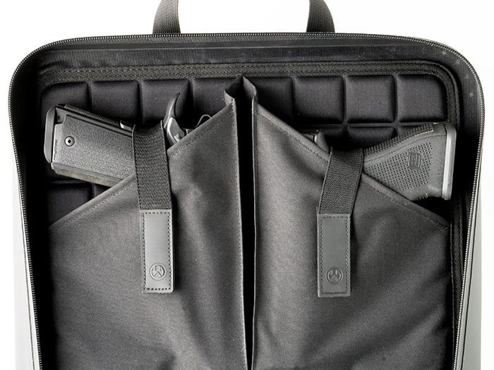 The DAKA Double Pistol Case is a large-format carrying case designed to secure and protect your firearms. The discrete, semi-rigid, double pistol case includes two large carrying handles, making it perfect for transporting and storing all sizes of pistols and their magazines.

The two internal panels are lined with a snag-free, protective EVA foam liner that adds a layer of security and a barrier against damage. On the left panel, there are two large pistol sleeves that can accommodate subcompact, compact, and full-size pistols. Each pistol sleeve has its own retaining strap that can stretch to accommodate a variety of pistol sizes. On the right panel, there are eight magazine retention bands and a large outer panel pocket to protect your pistols from contacting your magazines and causing damage. An additional zippered pocket can also be used to store documents, small tools, or cleaning items.

Constructed of durable DAKA material and featuring a water-resistant YKK® AquaGuard® zipper, a 550 paracord zipper pull, and a pull-tab that doubles as a carabiner pass-through, the DAKA Double Pistol Case is rugged, water-resistant, and the perfect storage solution for those times when one pistol is not enough.