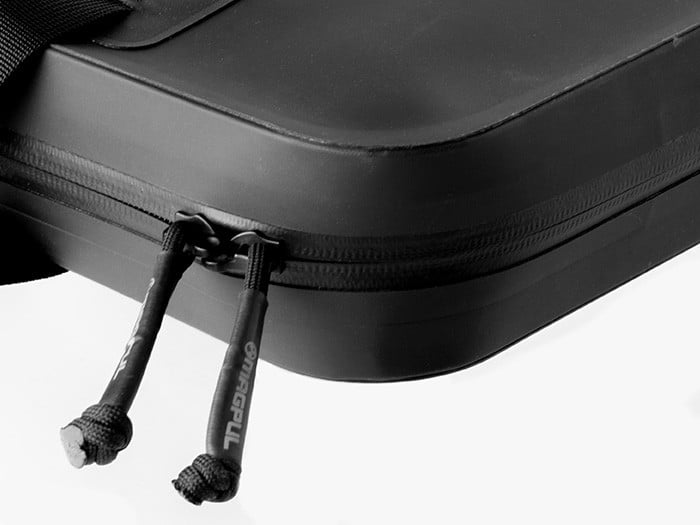 The DAKA Double Pistol Case is a large-format carrying case designed to secure and protect your firearms. The discrete, semi-rigid, double pistol case includes two large carrying handles, making it perfect for transporting and storing all sizes of pistols and their magazines.

The two internal panels are lined with a snag-free, protective EVA foam liner that adds a layer of security and a barrier against damage. On the left panel, there are two large pistol sleeves that can accommodate subcompact, compact, and full-size pistols. Each pistol sleeve has its own retaining strap that can stretch to accommodate a variety of pistol sizes. On the right panel, there are eight magazine retention bands and a large outer panel pocket to protect your pistols from contacting your magazines and causing damage. An additional zippered pocket can also be used to store documents, small tools, or cleaning items.

Constructed of durable DAKA material and featuring a water-resistant YKK® AquaGuard® zipper, a 550 paracord zipper pull, and a pull-tab that doubles as a carabiner pass-through, the DAKA Double Pistol Case is rugged, water-resistant, and the perfect storage solution for those times when one pistol is not enough.