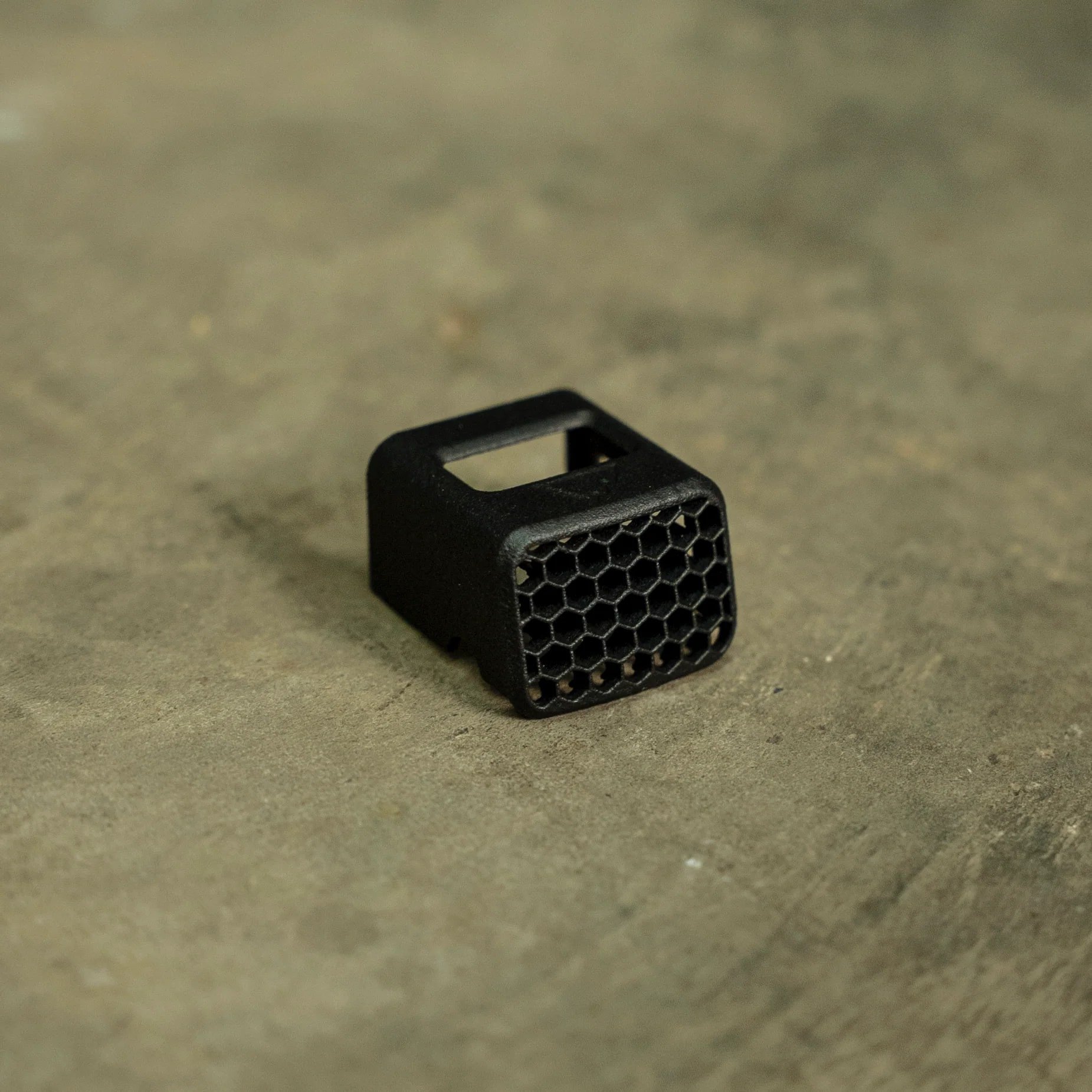 The HexCap is a ruggedly simple, snap-fit Anti-Reflection Device (ARD) that installs securely in seconds to your red dot sight with no additional hardware.
